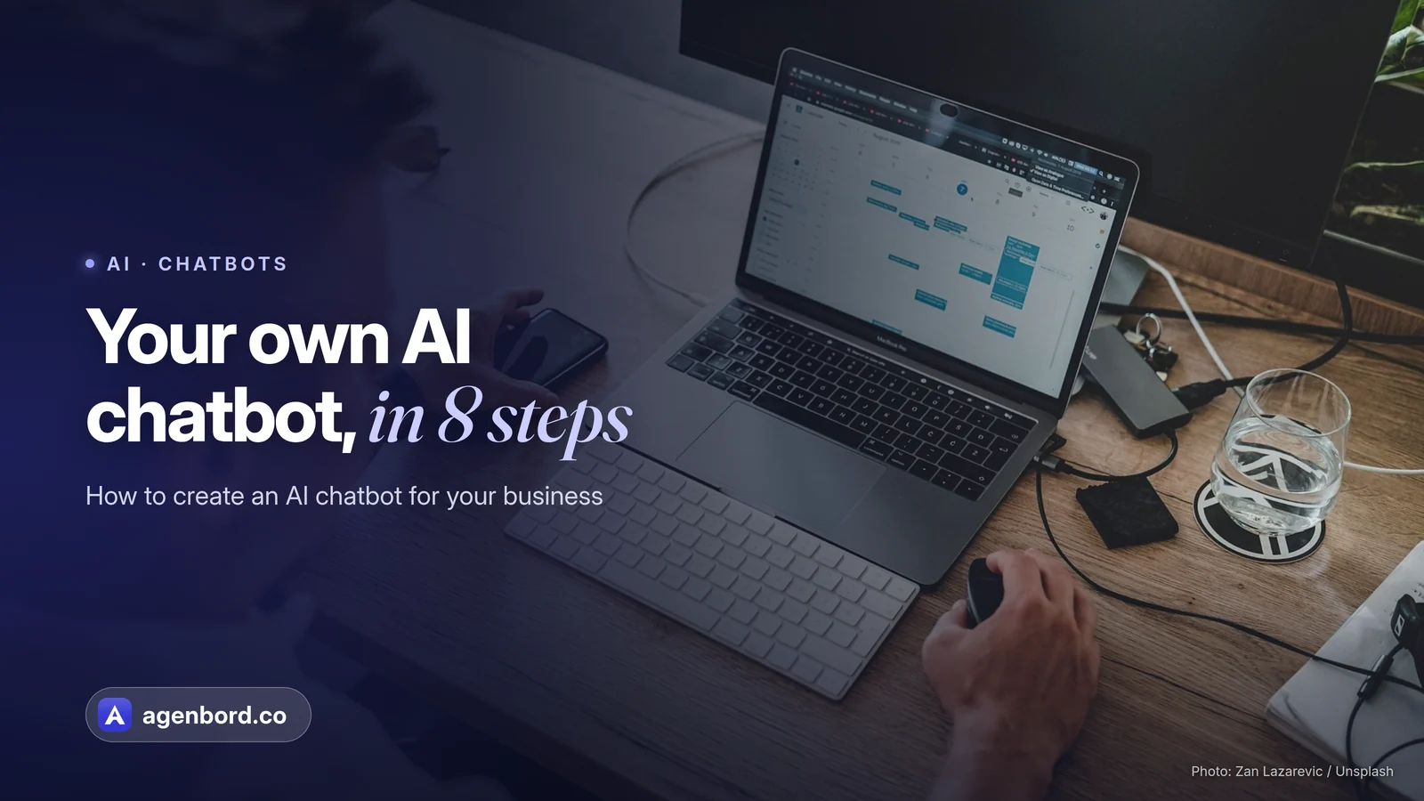 A man working on a laptop at a wooden desk. Headline: Your own AI chatbot, in 8 steps